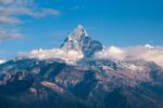 A mountain surrounded by clouds